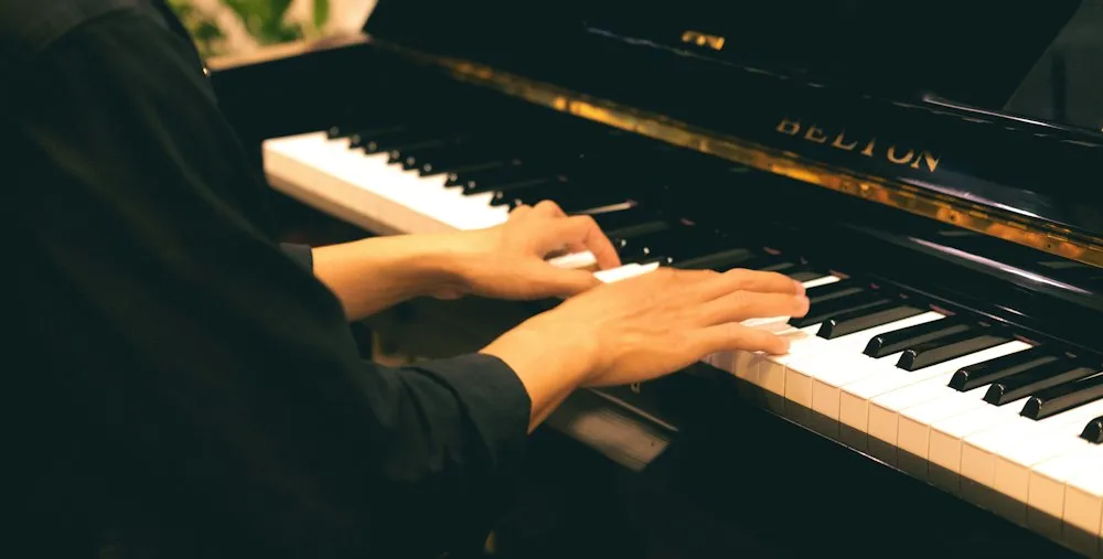 Hands playing piano