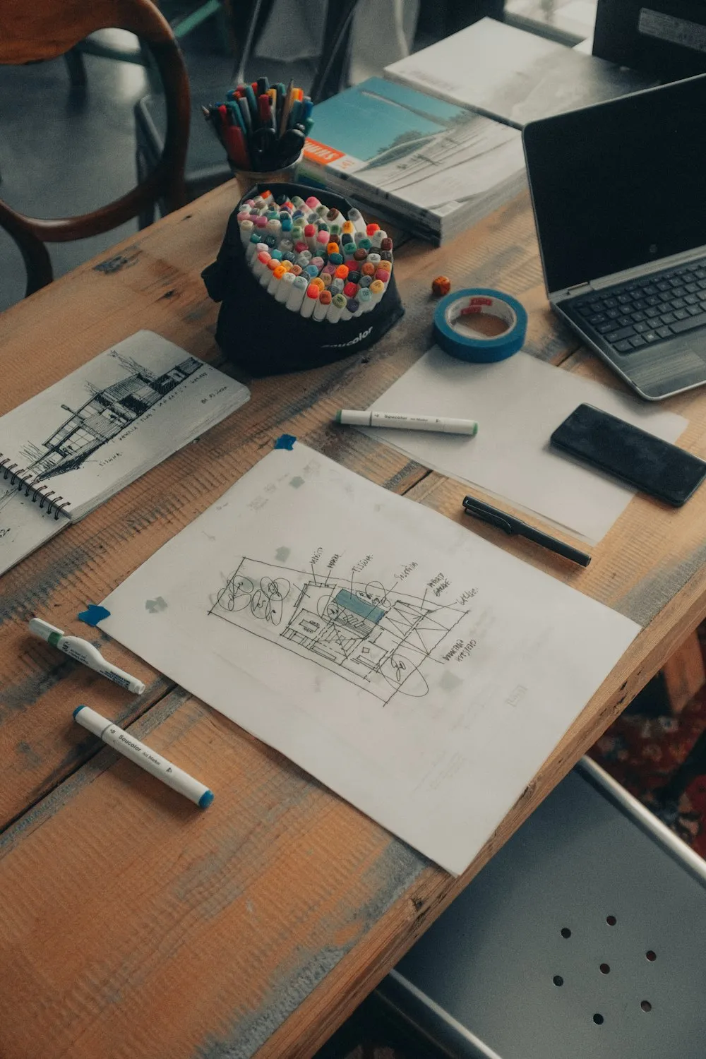 Project drawings and drafting tools on a desk