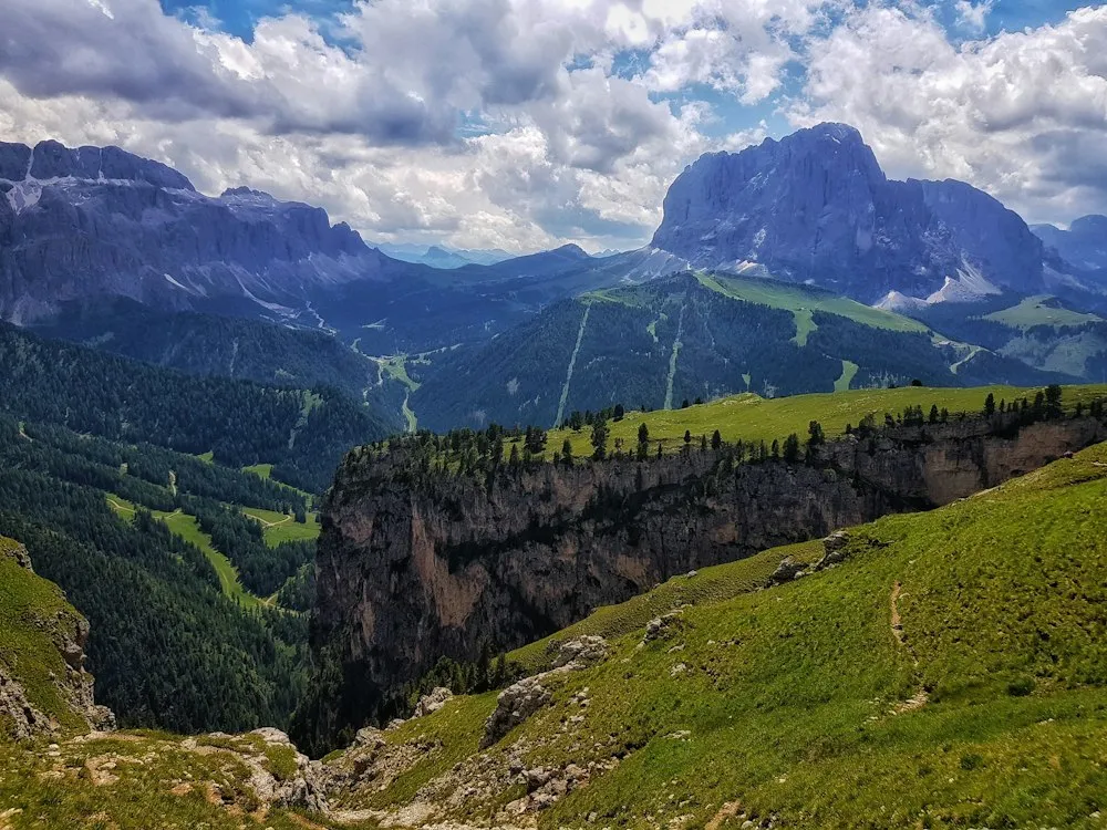 A remarkable panorama of green valleys and mountain cliffs