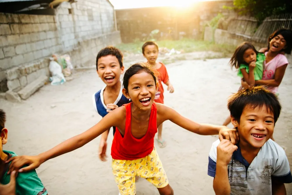 Children laughing together outdoors