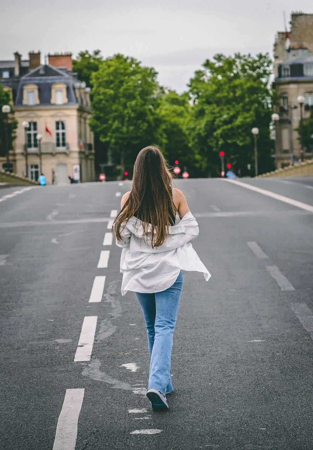 Woman walking home down a quiet city street