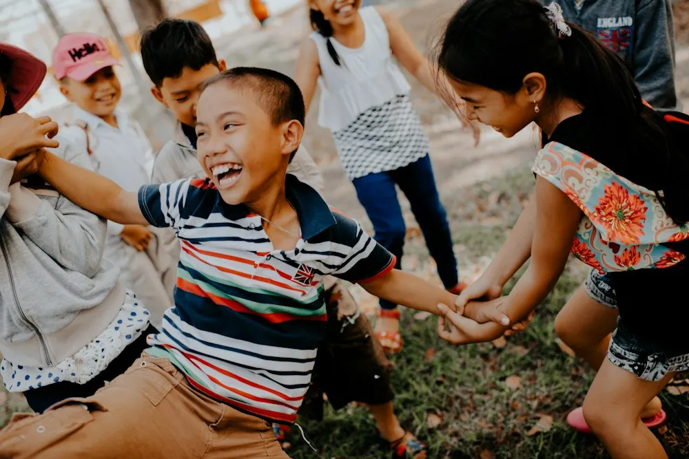 Children playing together on a grassy field