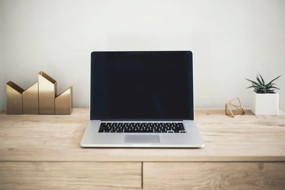 Laptop on a wooden table