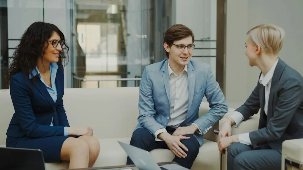 Business people discussing ideas on a couch